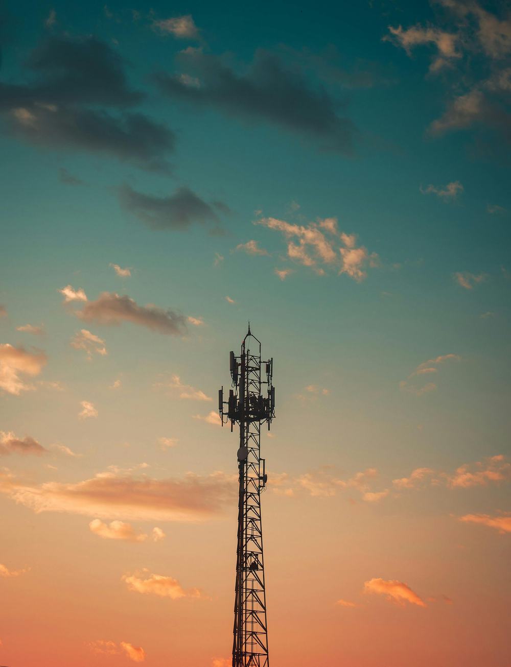 Cell tower against an evening sky